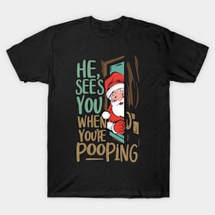 He see's you when you're pooping T-Shirt